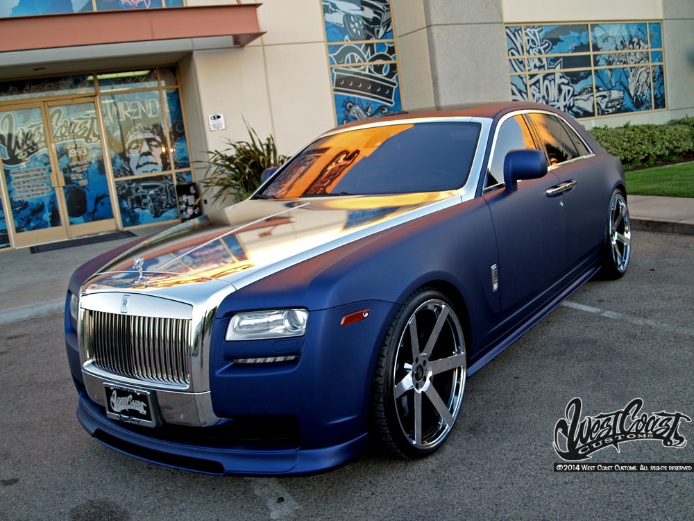 I give to you  a blue and gold Rolls Royce I took this picture in Dubai   9GAG